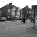 A couple of cyclists cross the road, Isobel's House Warming, a Gospel Hall, and Derelict Newsagents, Ward Road, Cambridge - 17th March 2007