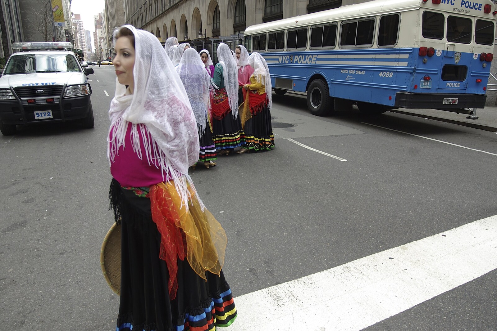 Persian Day Parade, Upper East Side and Midtown, New York, US - 25th March 2007: Crossing the street near a police bus