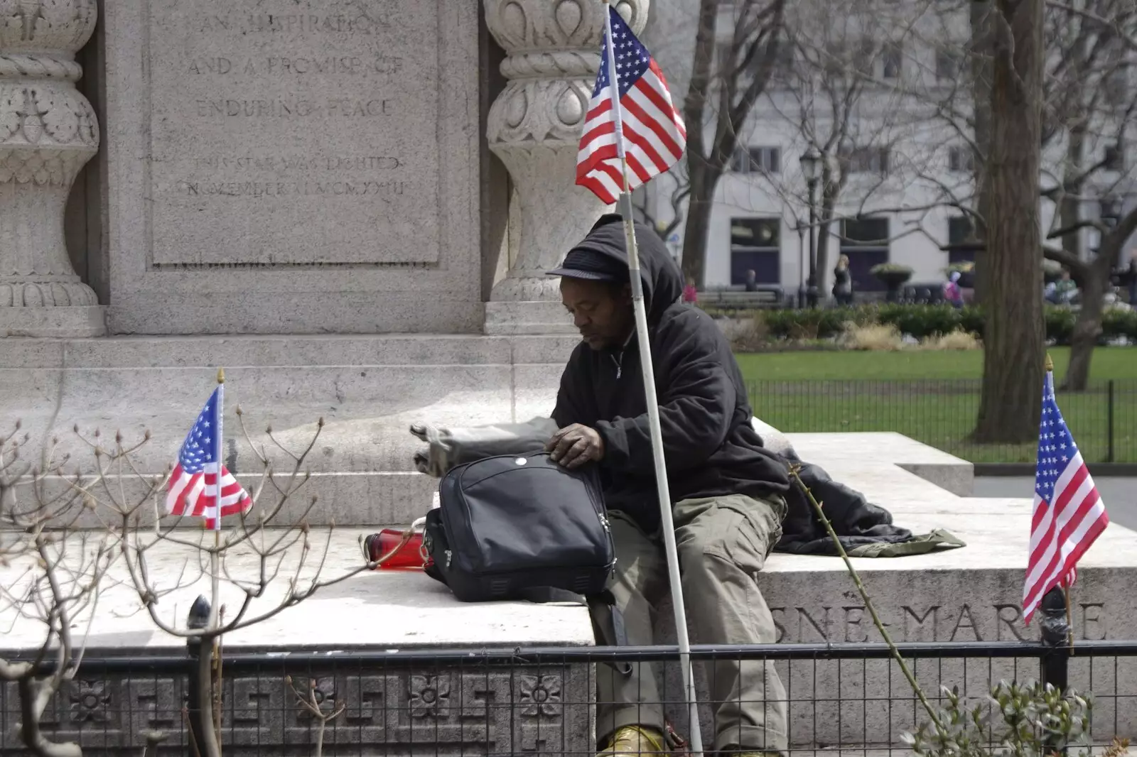 A homeless dude sits on a statue base, from Crossing Brooklyn Bridge, New York, US - 26th March 2007