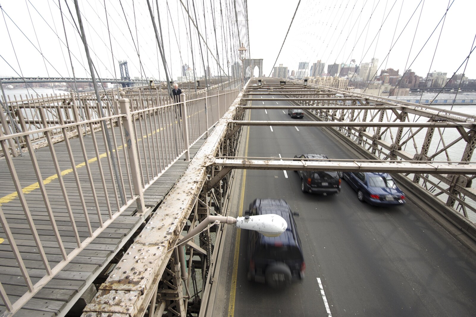 Crossing Brooklyn Bridge, New York, US - 26th March 2007: A view of traffic from the bridge