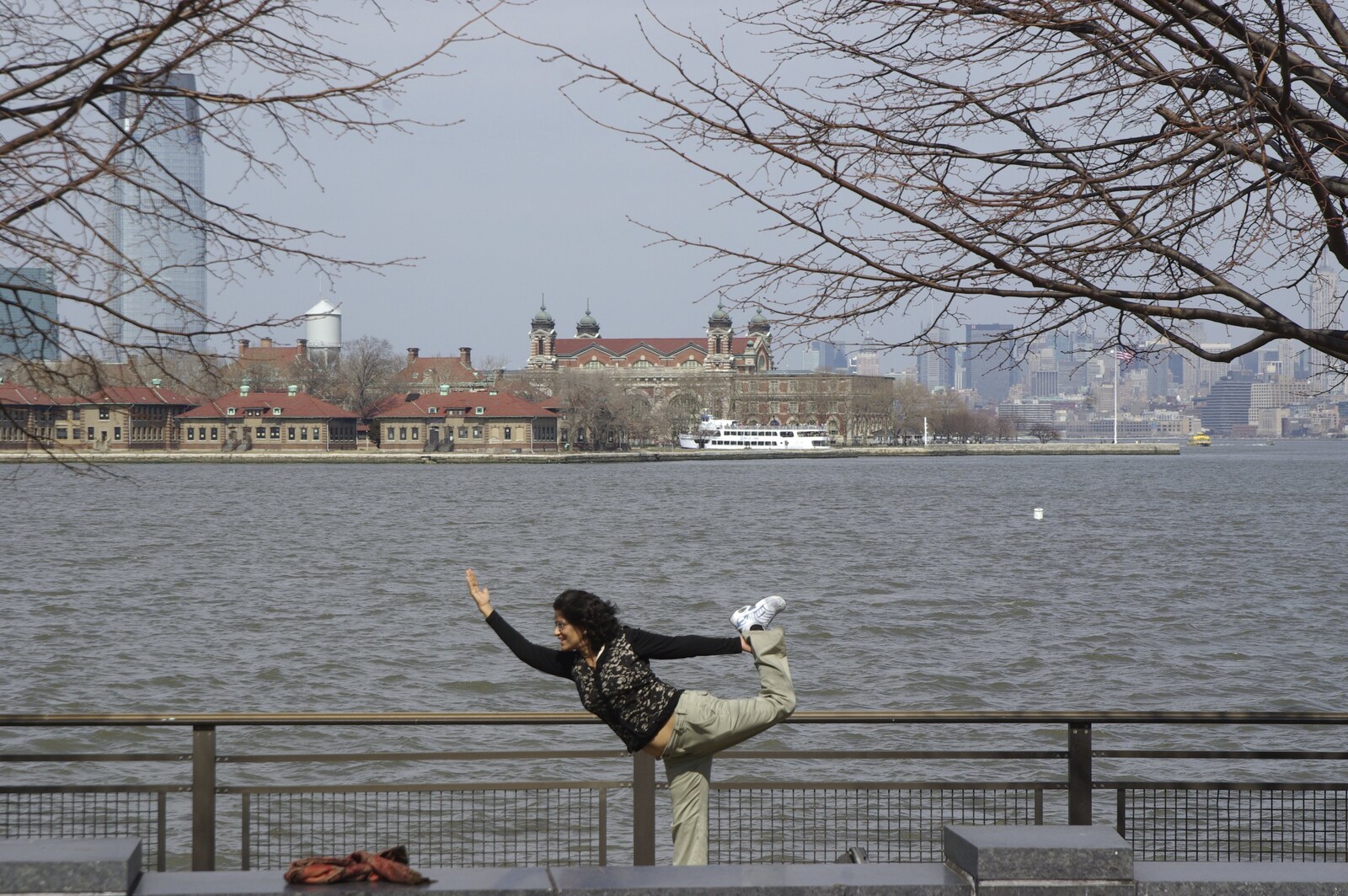 Liberty Island, A Helicopter Trip and Madison Square Basketball, New York, US - 27th March 2007: A tourist does a bizarre pose