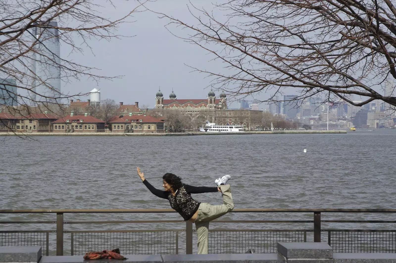 A tourist does a bizarre pose, from Liberty Island, A Helicopter Trip and Madison Square Basketball, New York, US - 27th March 2007