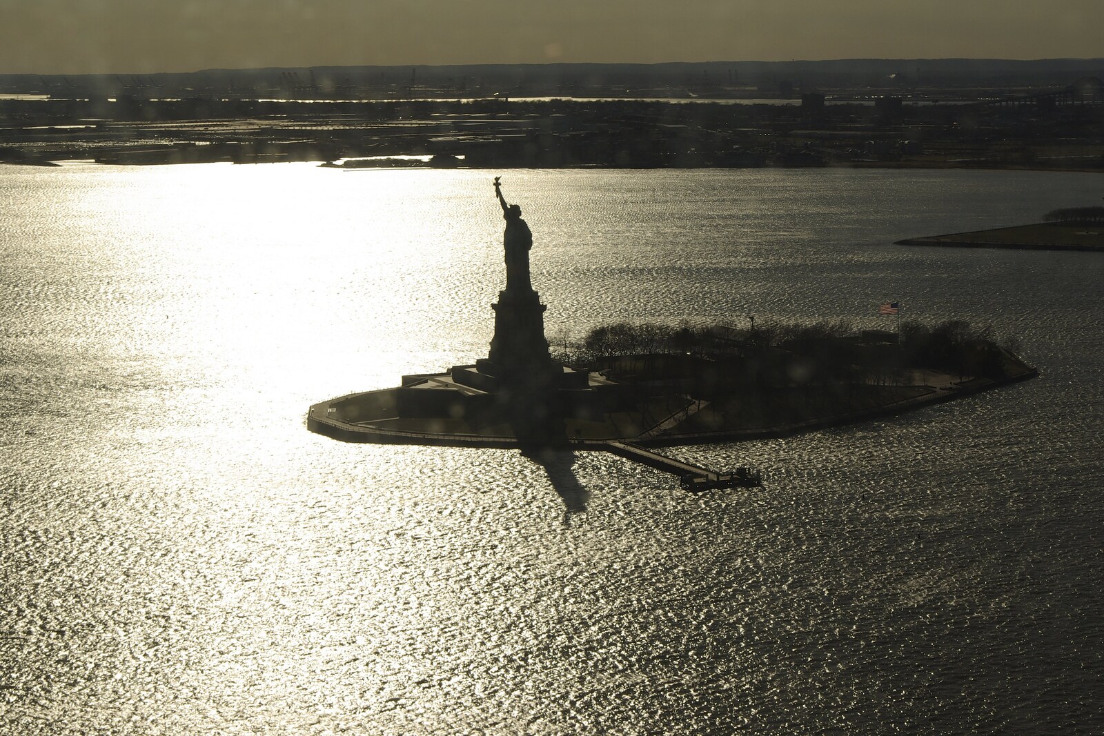 Liberty Island, A Helicopter Trip and Madison Square Basketball, New York, US - 27th March 2007: A back-lit Liberty Island
