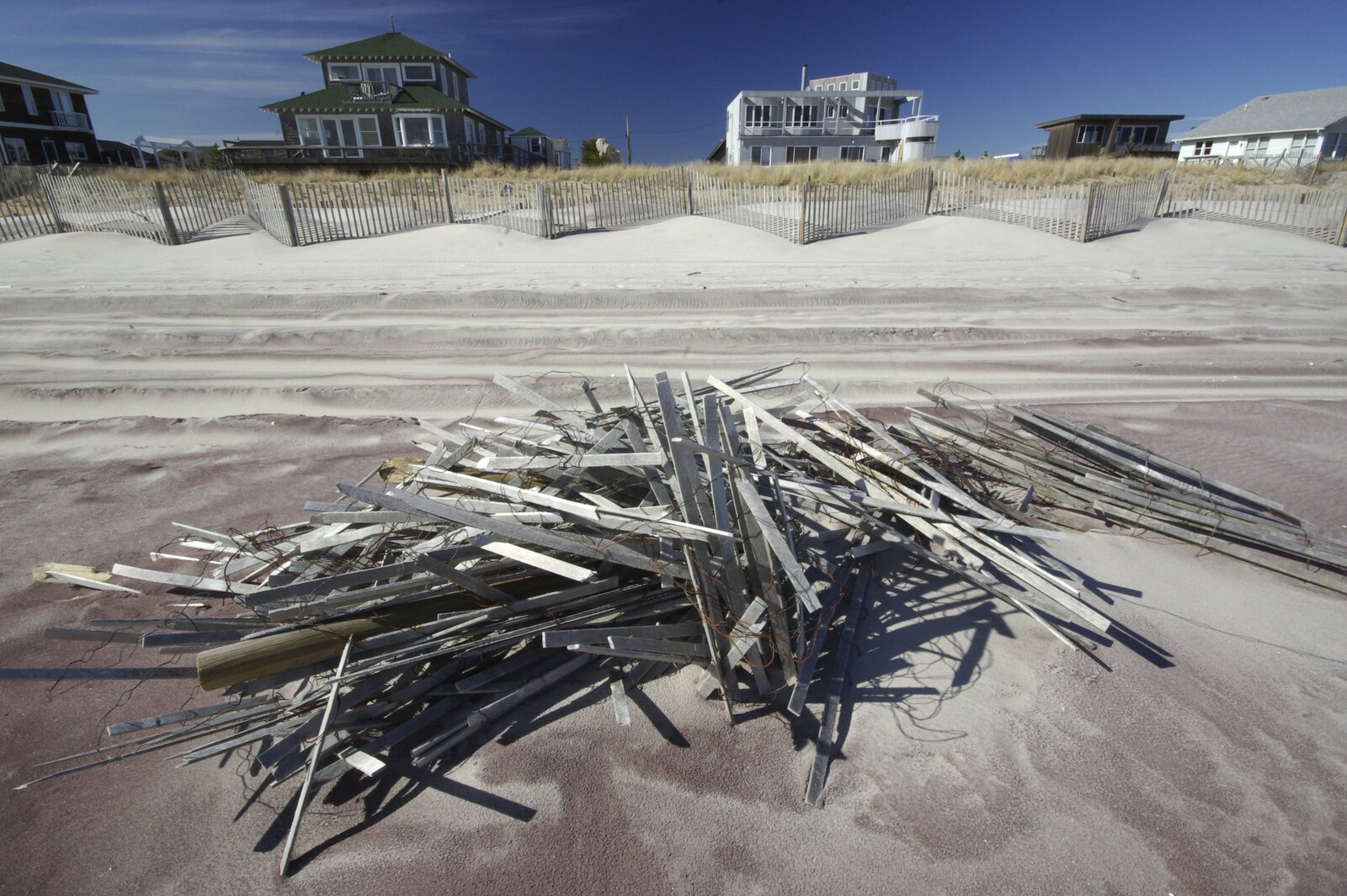 A Return to Fire Island, Long Island, New York State, US - 30th March 2007: A stack of discarded fencing lies on the beach