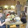 A blurry Isobel, a visitor, Sean and Michelle, and a plate of Nosher-cooked barbeque food