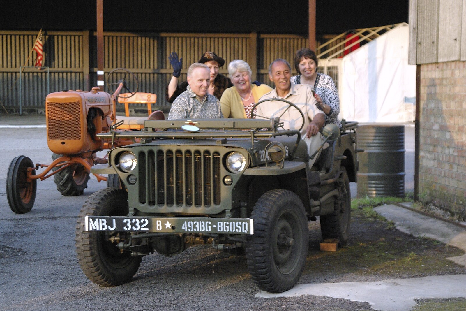 A 1940s Airfield Hangar Dance, Debach, Suffolk - 9th June 2007: People on a Willys Jeep