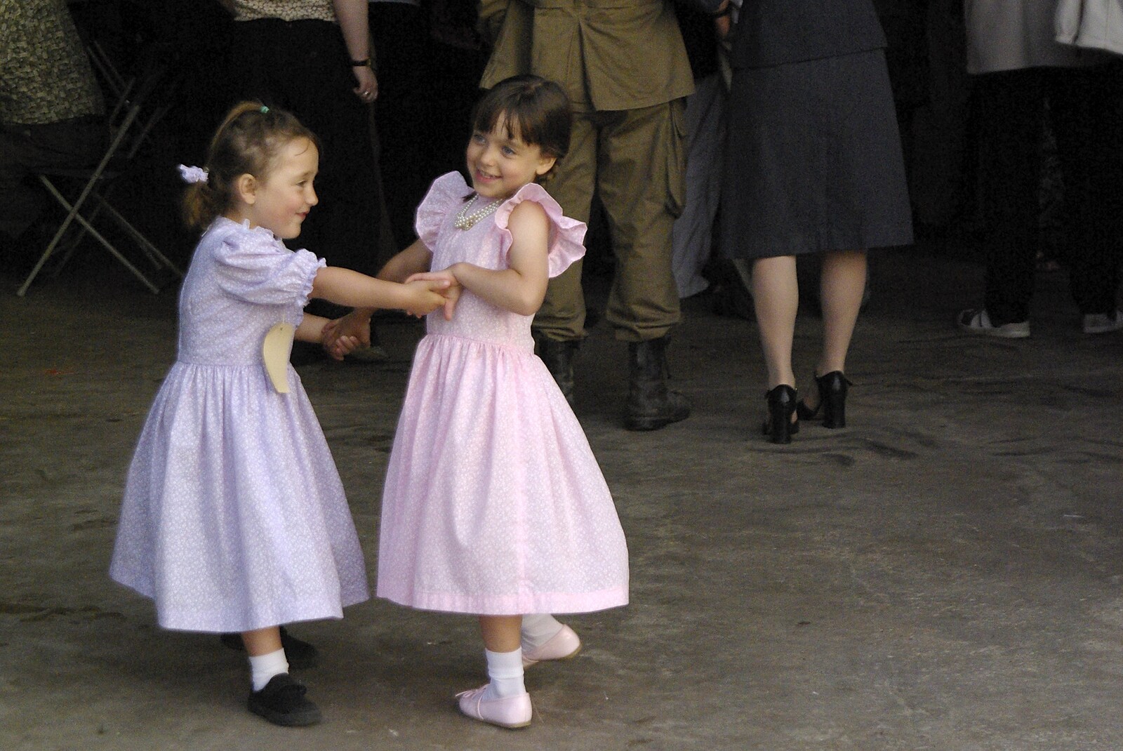A 1940s Airfield Hangar Dance, Debach, Suffolk - 9th June 2007: A couple of tiny 'evacuees' dance around