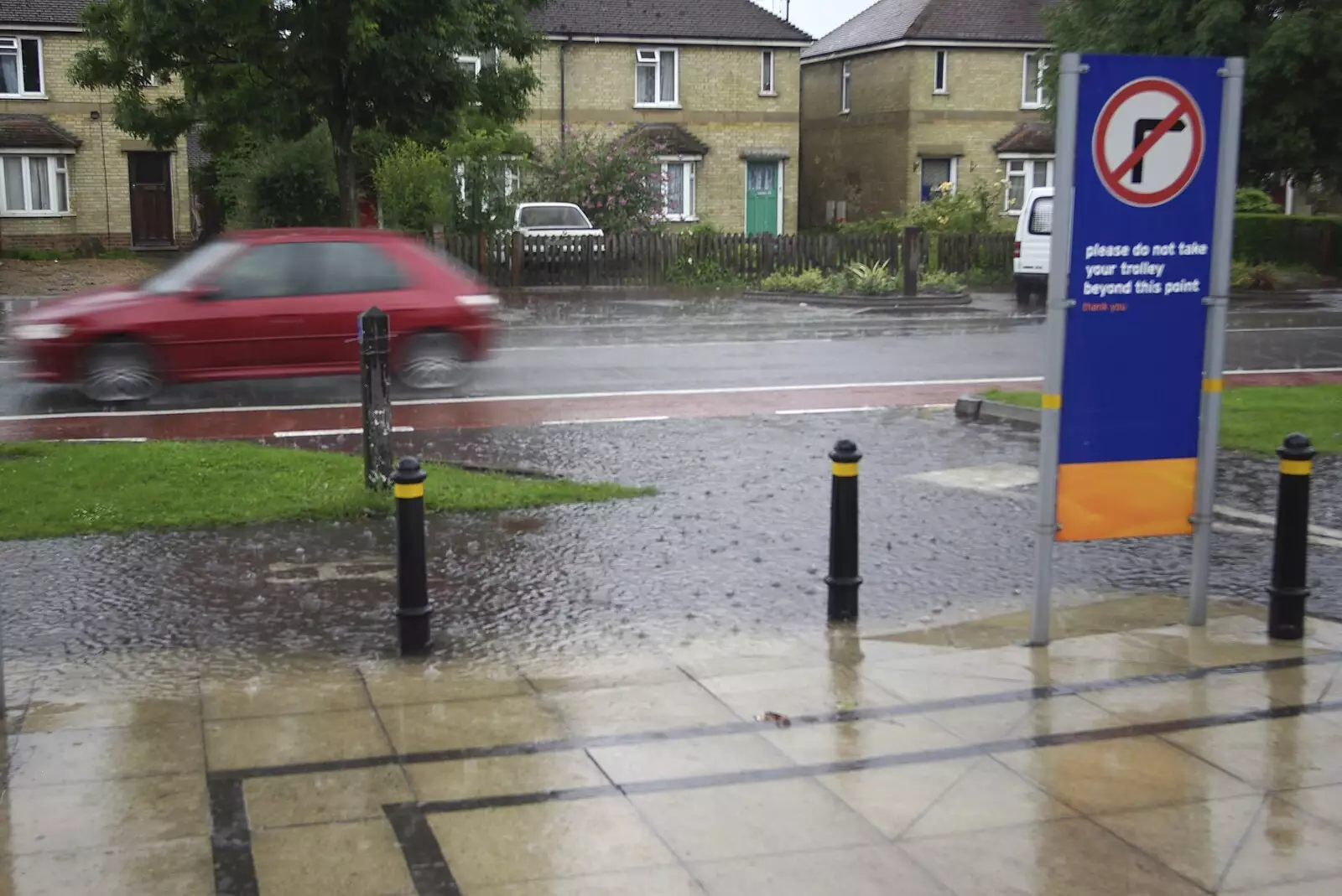 There's a mini flood outside Sainsbury's, from Genesis Live at Twickenham, and Music on Parker's Piece, London and Cambridge - 8th July 2007