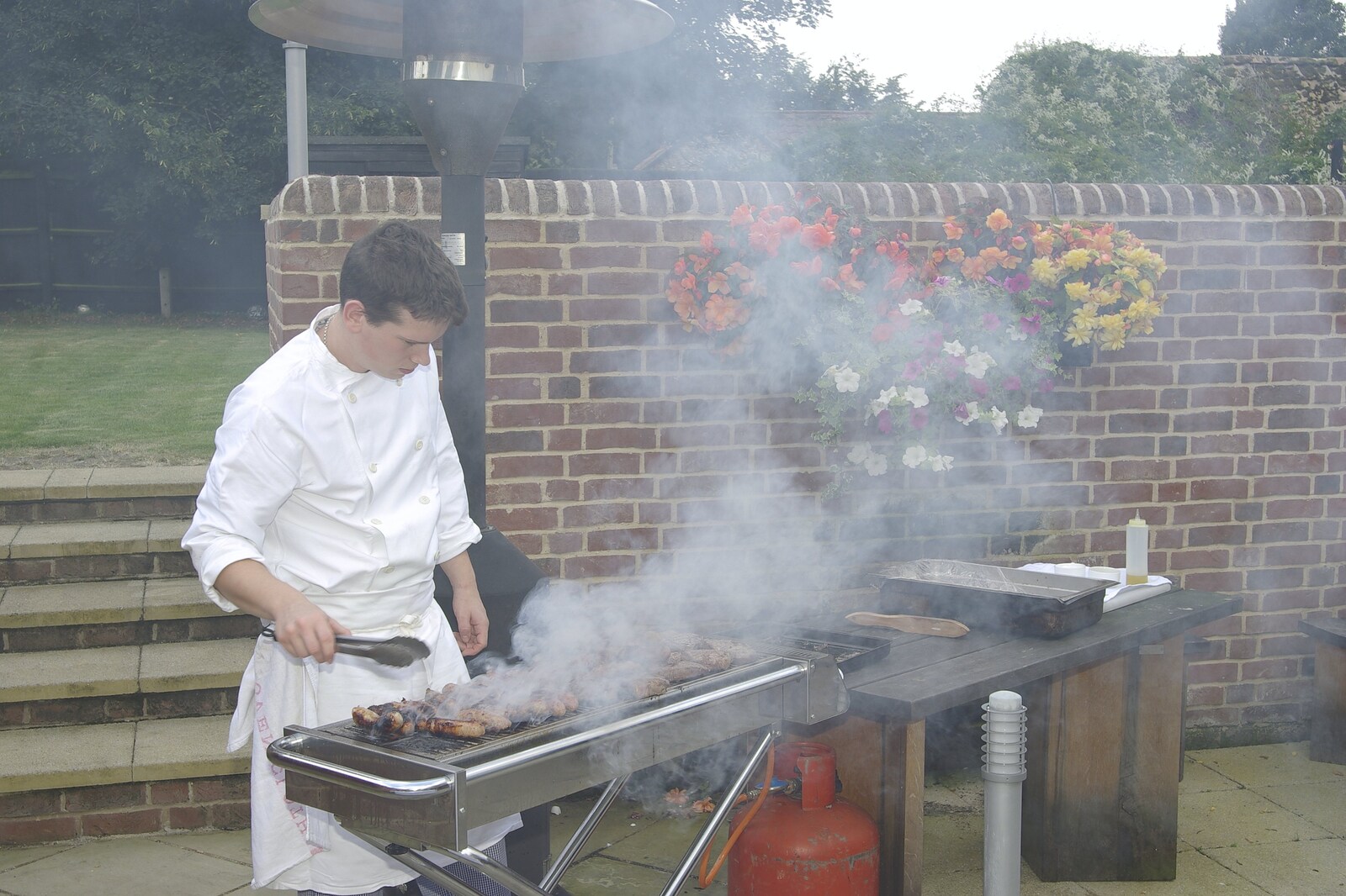Liviu and Christina's Wedding Day, Babraham, Cambridge - 11th August 2007: The barbeque is smopking away