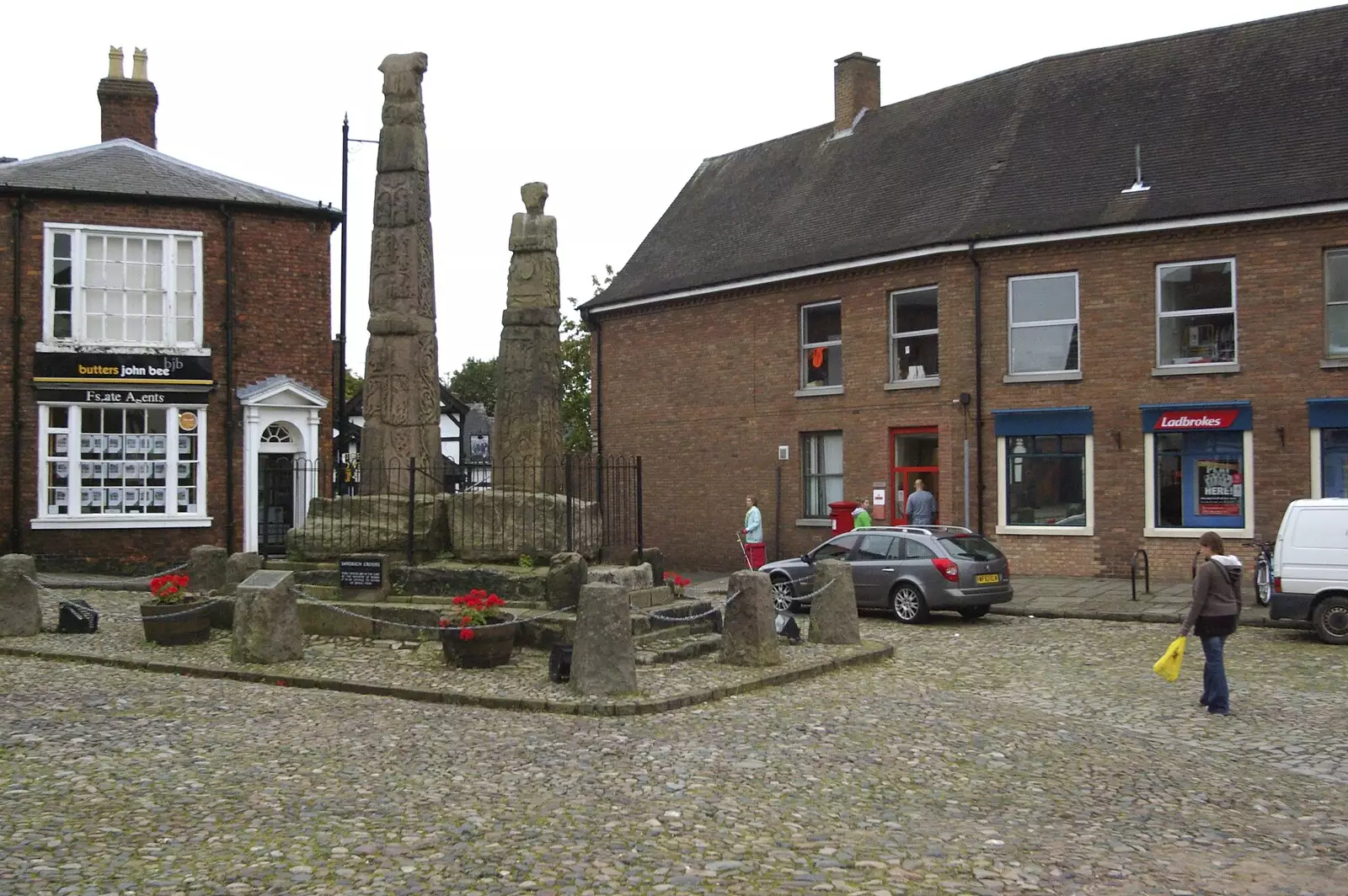 Isobel strides across the square near the Saxon Crosses, from A Road Trip to Ireland Via Sandbach and Conwy, Cheshire and Wales - 21st September 2007