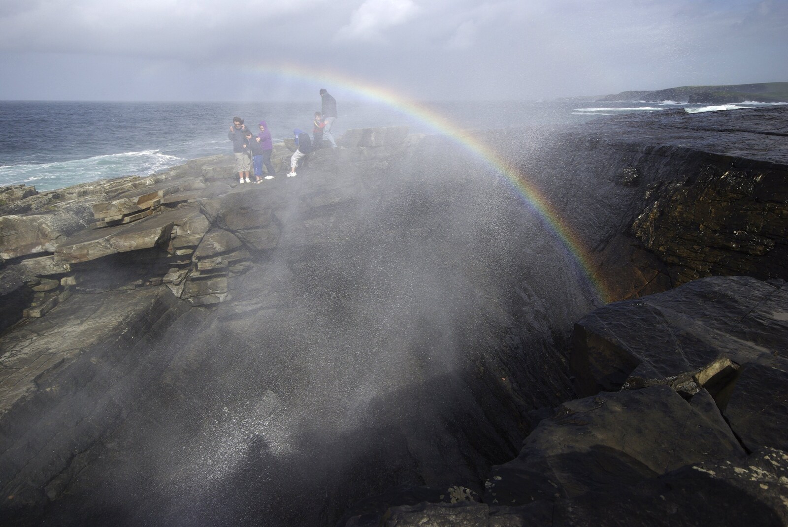 30th Birthday Party in Kilkee, County Clare, Ireland - 22nd September 2007: A rainbow is formed as spray blasts up though the 'Puffin' Hole'