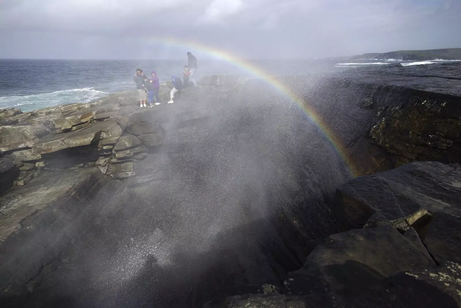 A rainbow is formed as spray blasts up though the 'Puffin' Hole', from 30th Birthday Party in Kilkee, County Clare, Ireland - 22nd September 2007