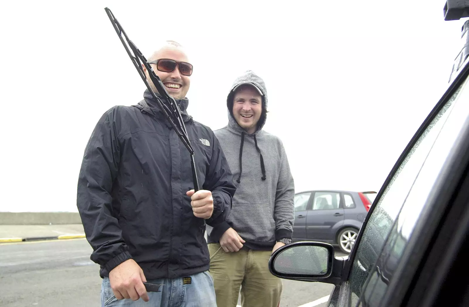 The boys giggle guiltily having destroyed the car's windscreen-wiper, from 30th Birthday Party in Kilkee, County Clare, Ireland - 22nd September 2007