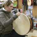 In a music shop, Isobel tries out a bit of bodhrán, Kilkee to Galway, Connacht, Ireland - 23rd September 2007