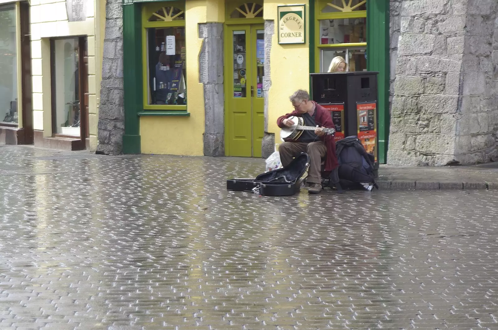 A busker does his thing on shiny cobbles, from Kilkee to Galway, Connacht, Ireland - 23rd September 2007