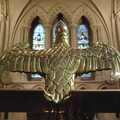 The lectern yearns to fly away through the stained-glass windows