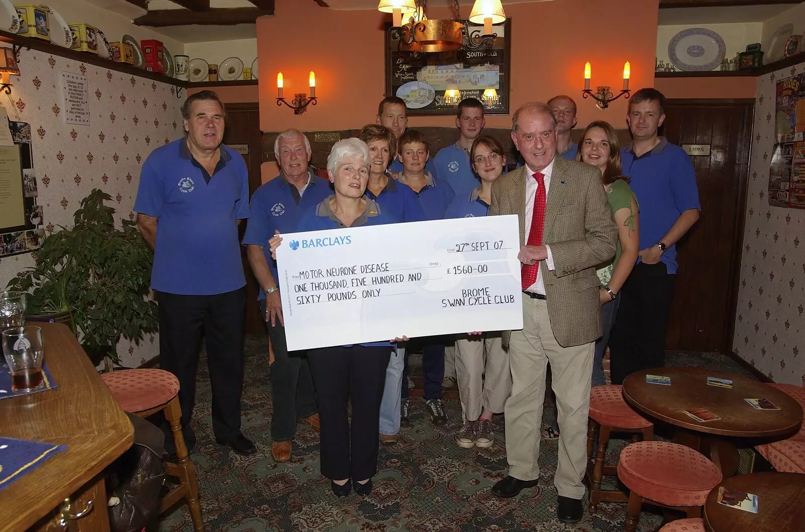 A cycle club group shot with the cheque, from A BSCC Presentation, and Matt's Wedding Reception, Solihull - 6th October 2007