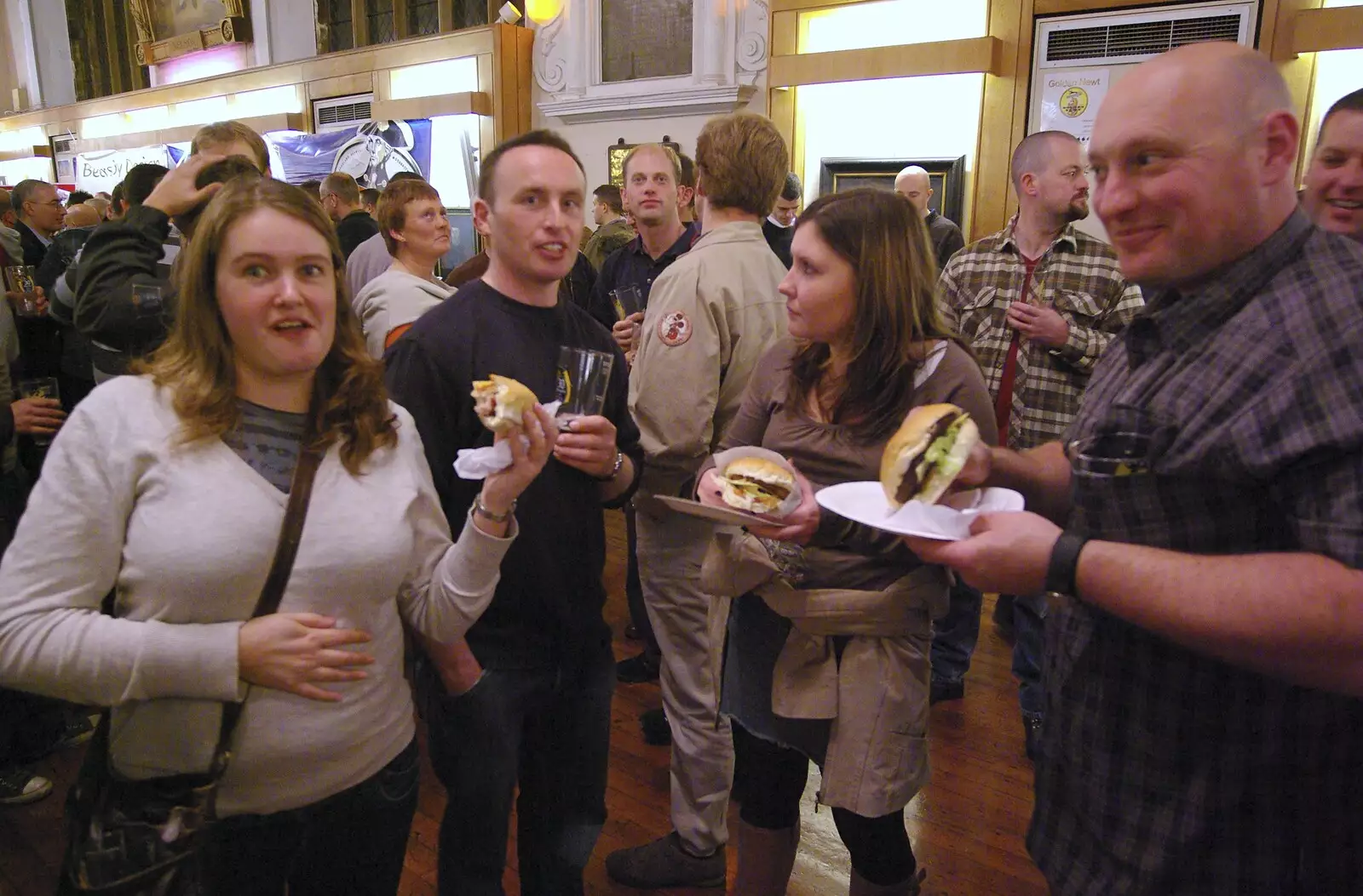 Isobel scoffs a burger, from The Brome Swan at the 30th Norwich Beer Festival, Norfolk - 24th October 2007