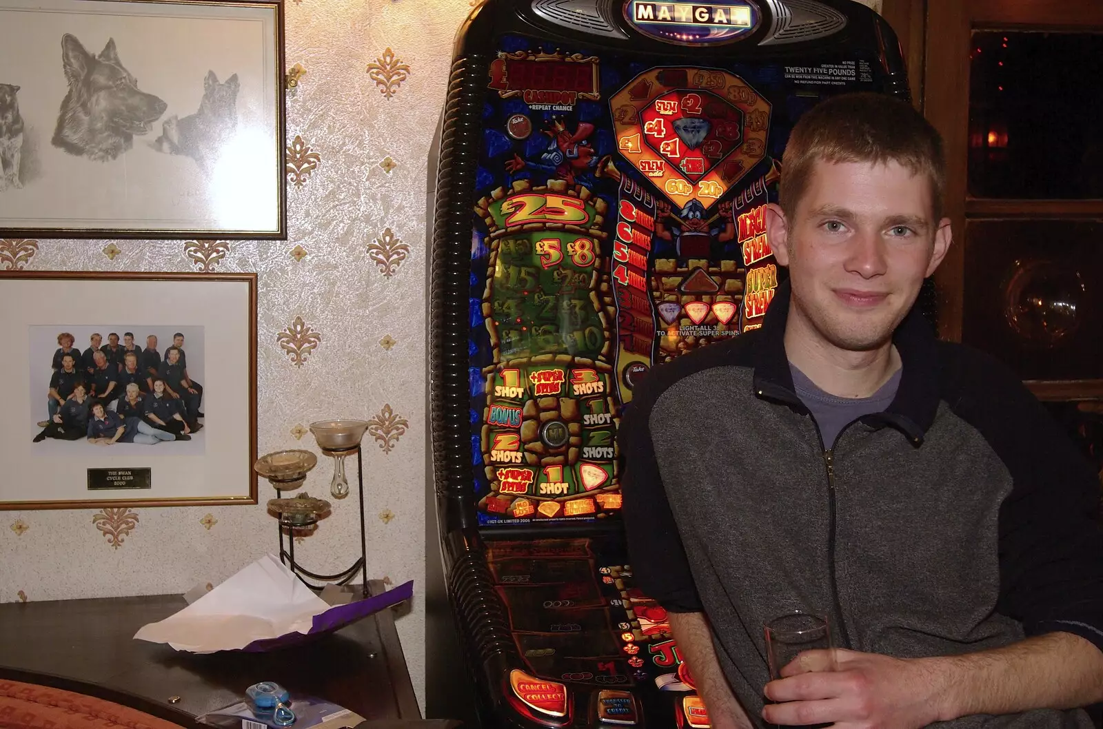 The Boy Phil leans on the fruit machine, from The Boy Phil Leaves, Swan Inn, Brome, Suffolk - 4th November 2007