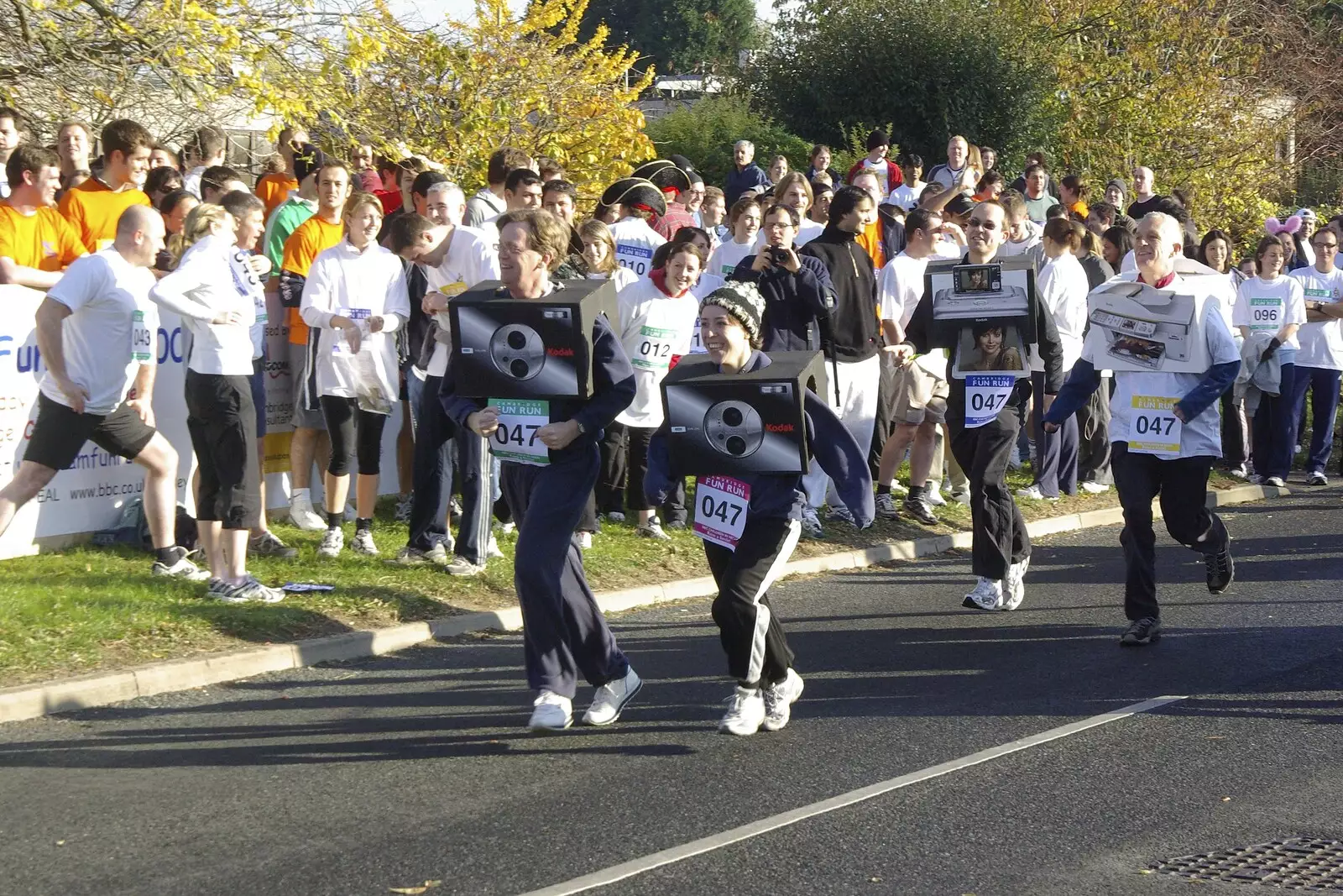 The Kodak team runs around with camera boxes, from Isobel and the Science Park Fun Run, Milton Road, Cambridge - 16th November 2007