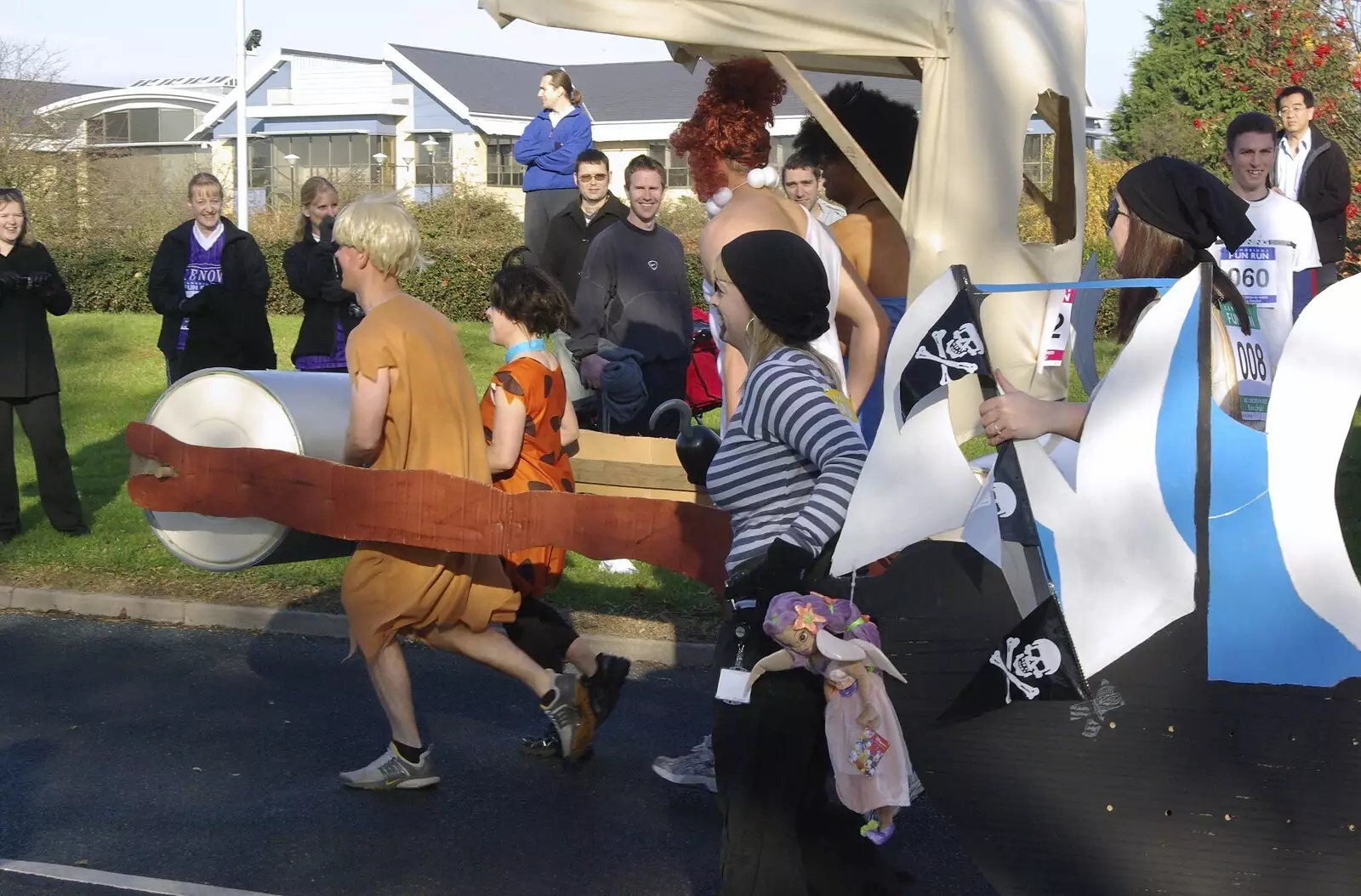 A Flintstones team runs past, from Isobel and the Science Park Fun Run, Milton Road, Cambridge - 16th November 2007