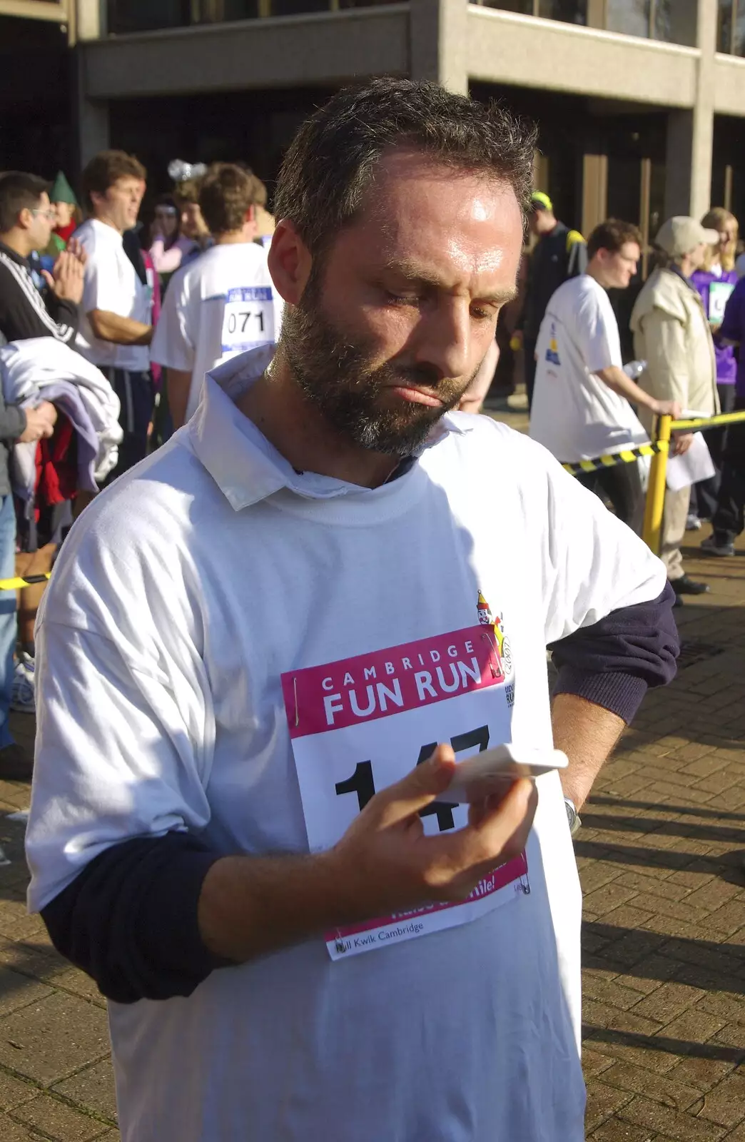 Craig checks his times, from Isobel and the Science Park Fun Run, Milton Road, Cambridge - 16th November 2007