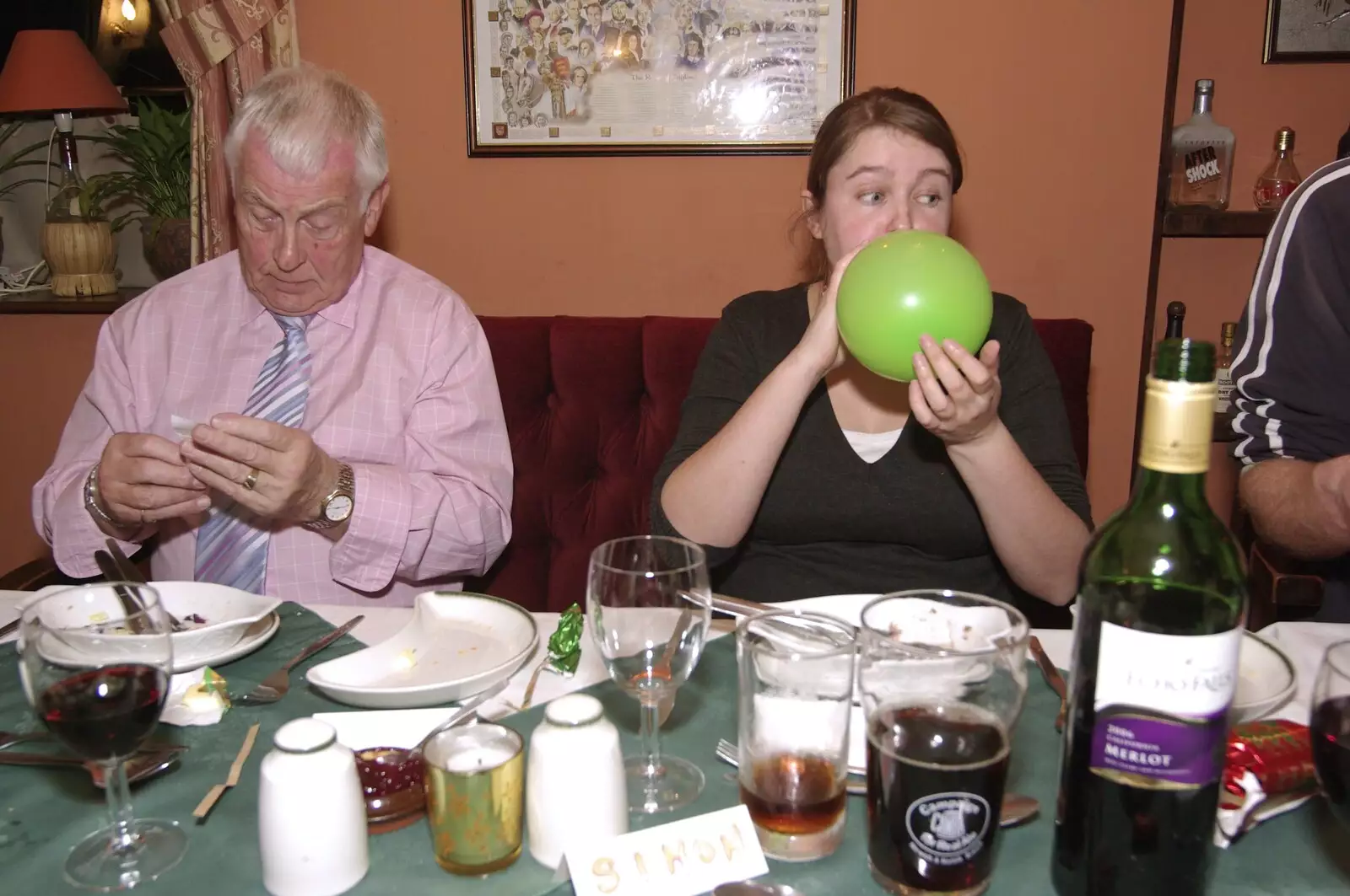 Isobel blows a balloon up, from The BSCC Christmas Dinner, Swan Inn, Brome, Suffolk - 8th December 2007