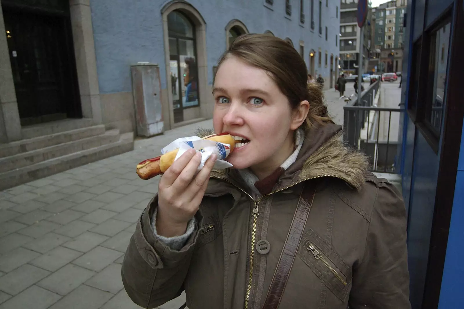 Isobel tucks in to a tasty sausage snack, from Gamla Stan, Stockholm, Sweden - 15th December 2007