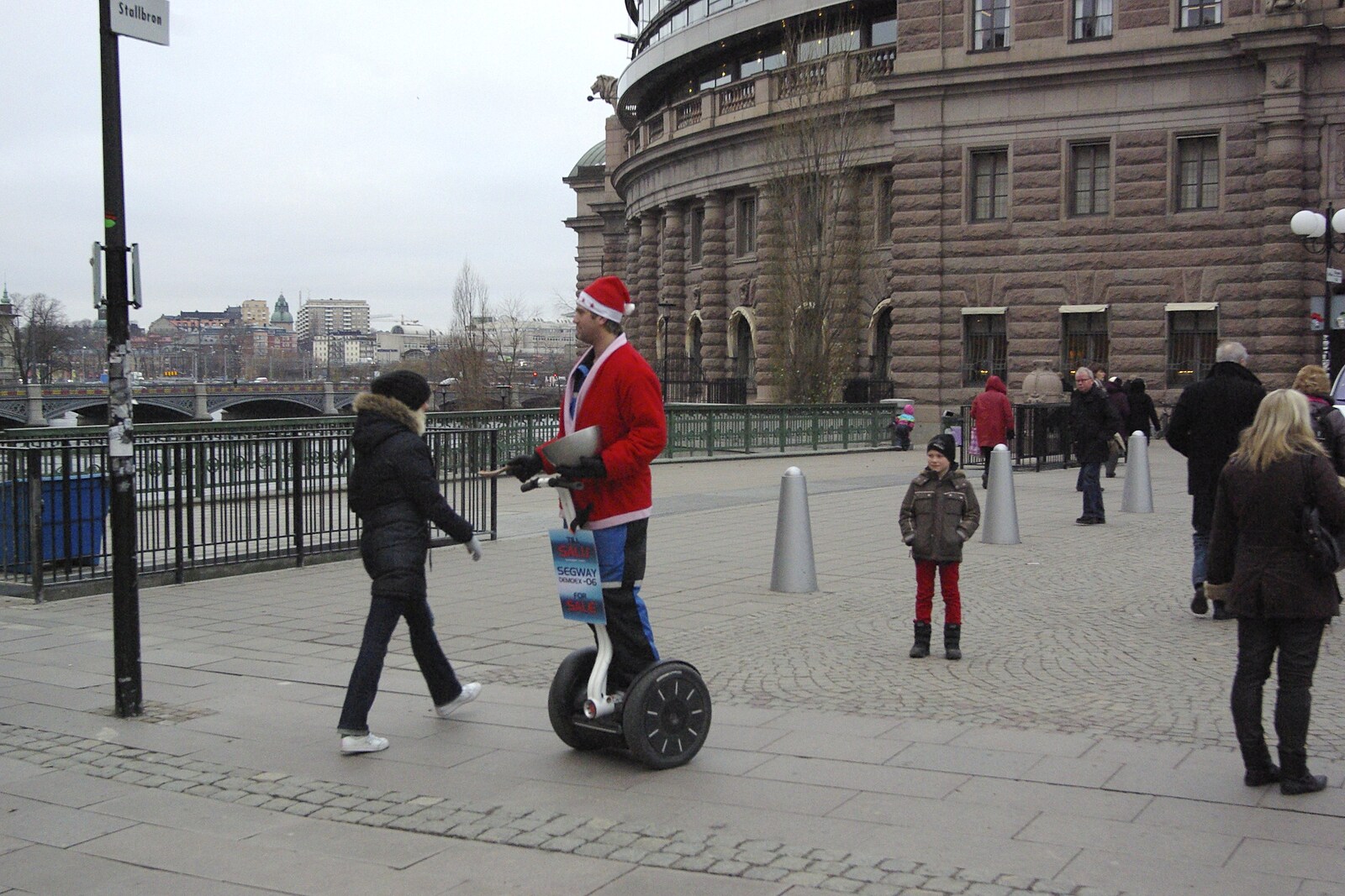A guy on a Segway roams around handing out roasted nuts from Gamla Stan, Stockholm, Sweden - 15th December 2007