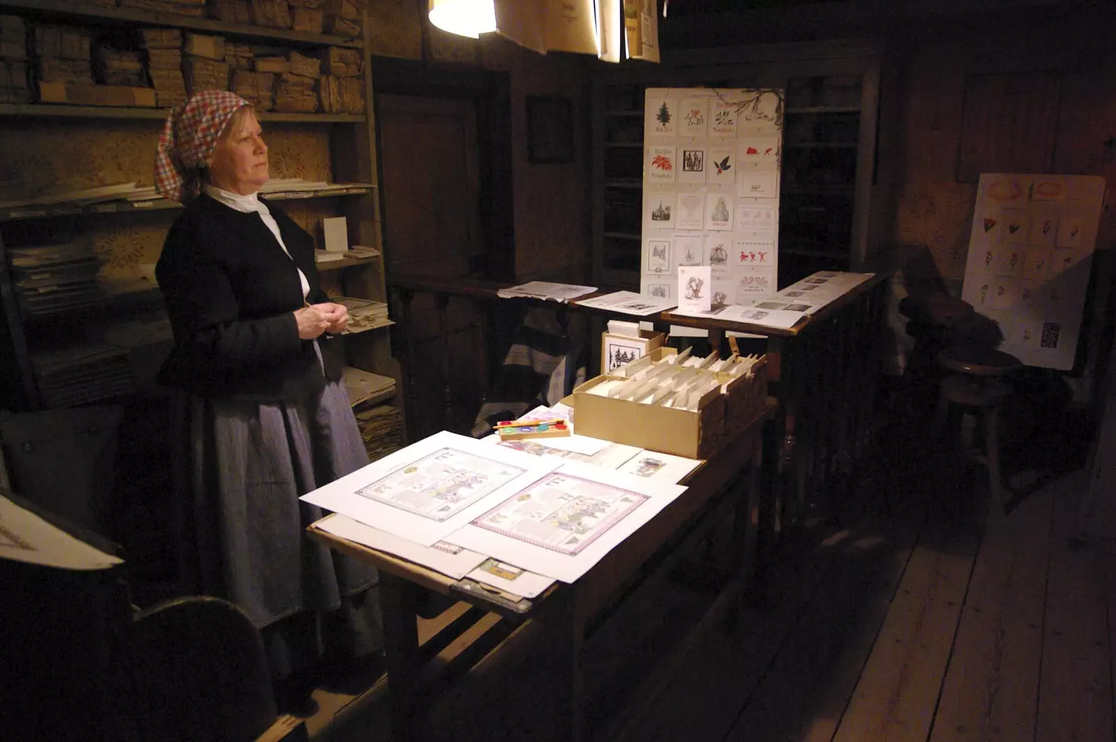 A woman shows off some prints, from A Few Hours in Skansen, Stockholm, Sweden - 17th December 2007