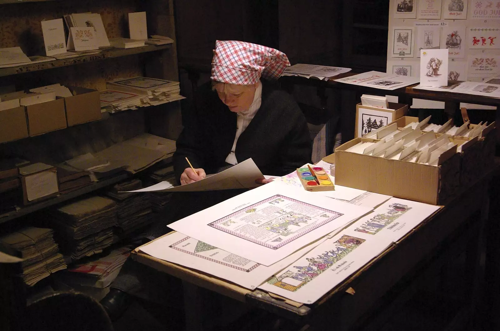 A woman hand-paints some printed illustrations, from A Few Hours in Skansen, Stockholm, Sweden - 17th December 2007