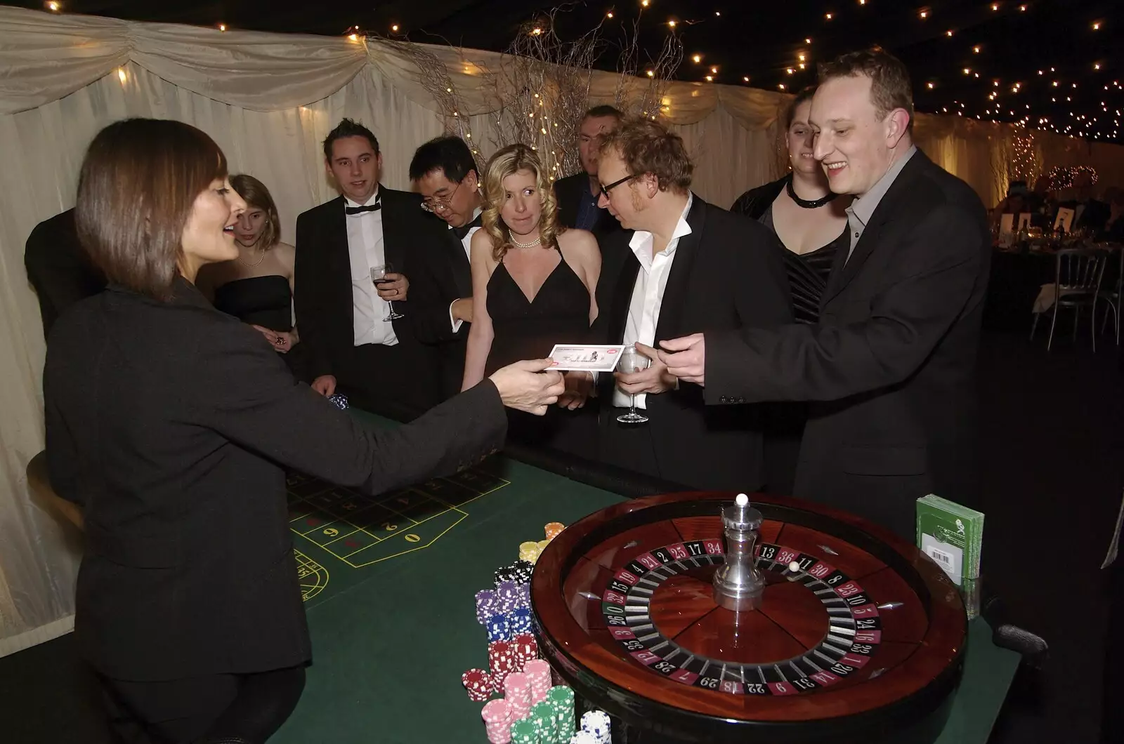 Stuart cashes his fake money in for chips, from Qualcomm Cambridge's Christmas, Hotel Felix, Cambridge - 20th December 2007