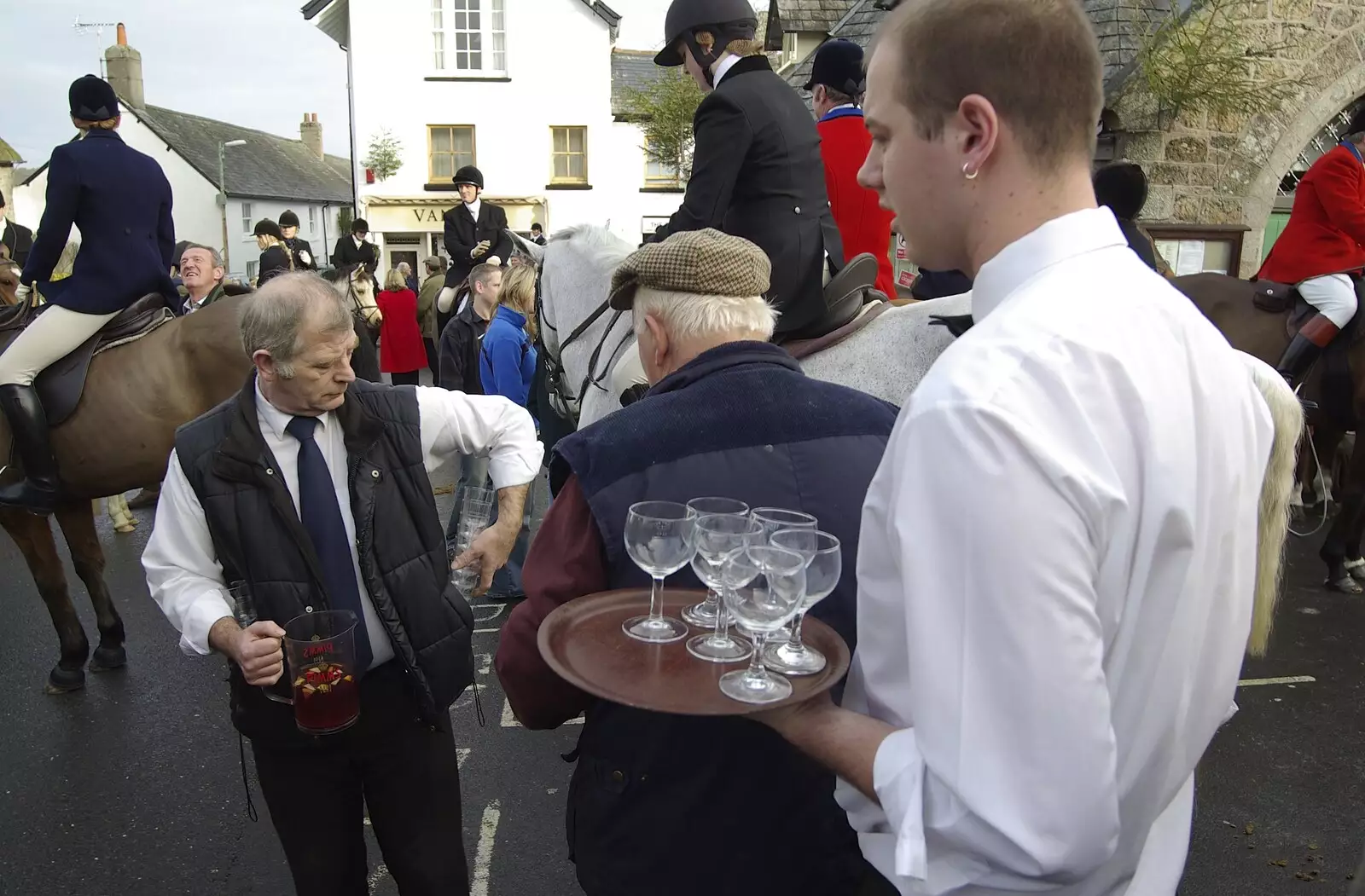 A barman collects glasses, from A Boxing Day Hunt, Chagford, Devon - 26th December 2007