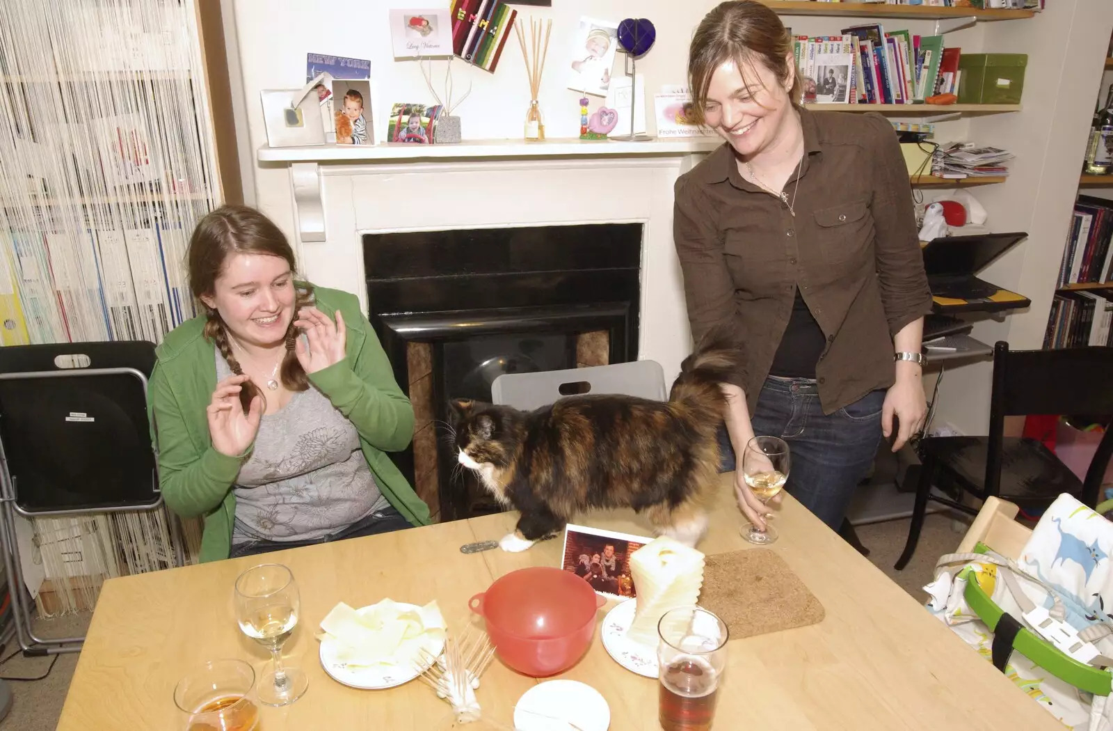 The cat walks around the dinner table, from Thai with Rachel and Sam, and Steve's Taptu Birthday Cake, Cambridge - 12th January 2008