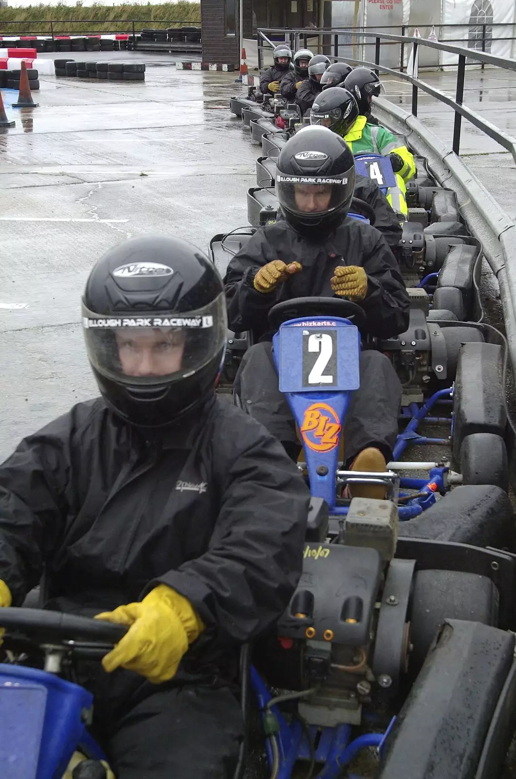 The drivers rev their engines in the pits, from Gov's Stag-Day Karting, Ellough Airfield, Beccles, Suffolk - 19th January 2008