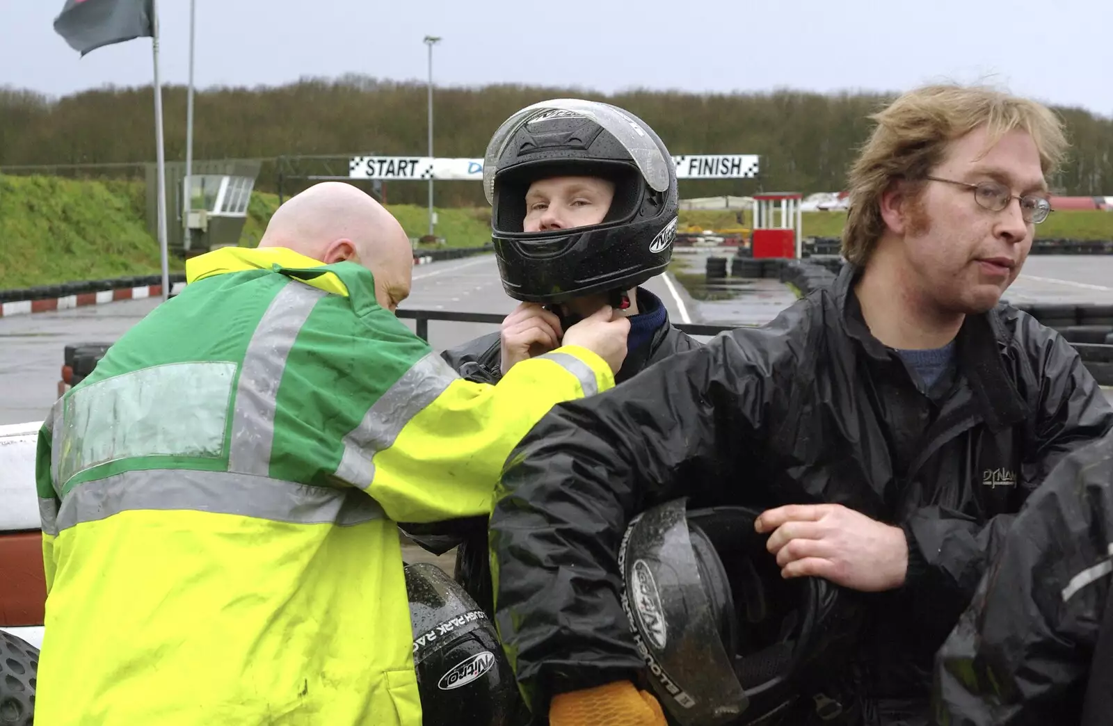 Gov helps Mikey-P out of his helmet, from Gov's Stag-Day Karting, Ellough Airfield, Beccles, Suffolk - 19th January 2008