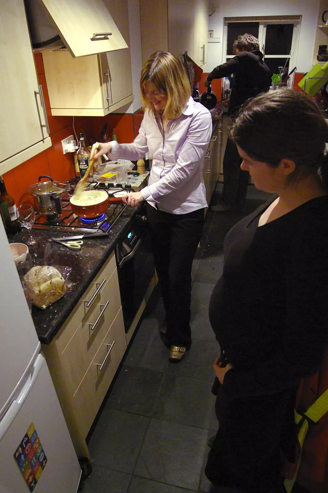 Rachel does fondue as Isobel looks on, from Organ Practice, Swiss Fondue and Curry With Gov, Thorndon, Cambridge and Diss - 27th January 2008