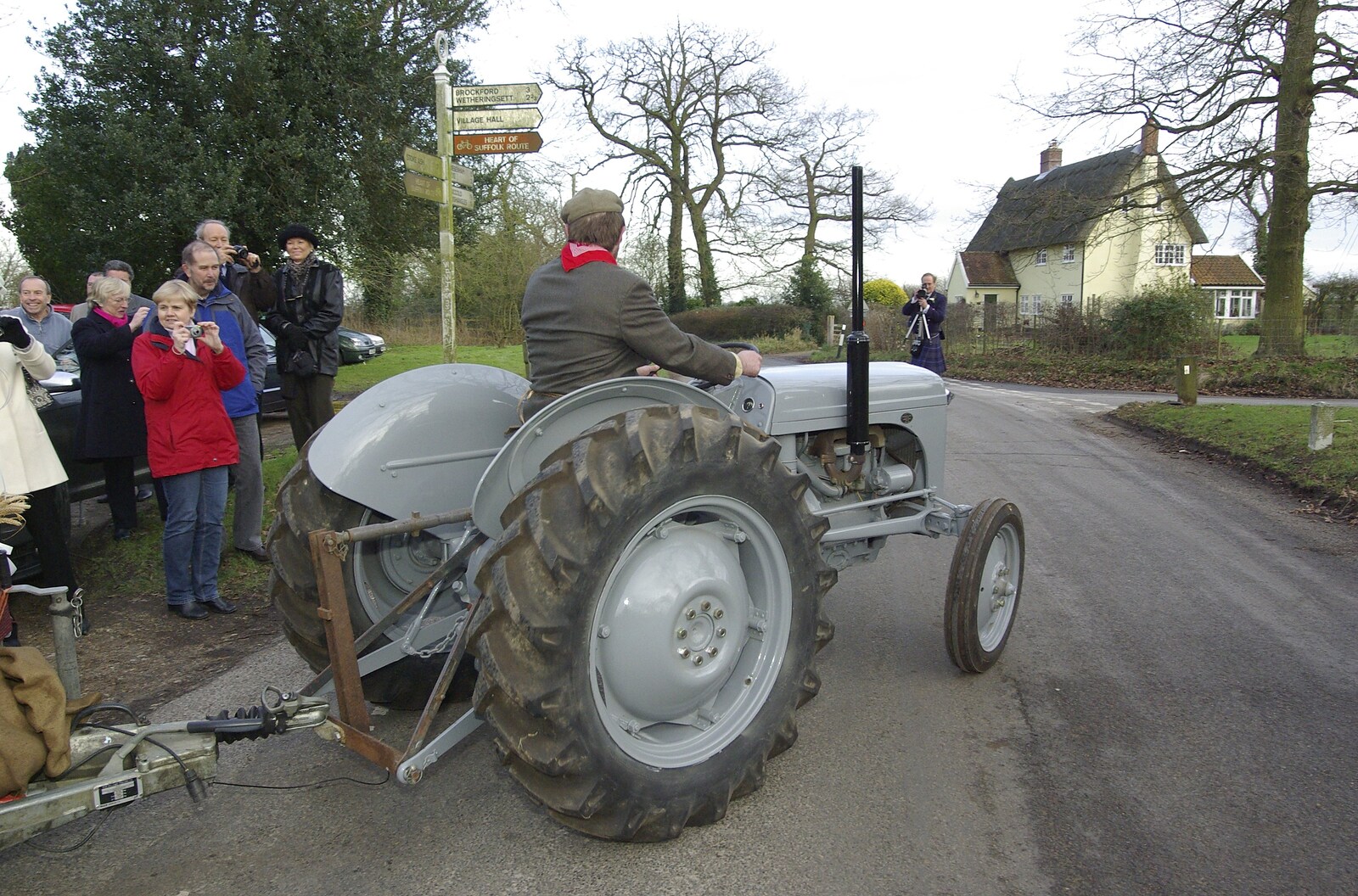 The tractor pulls out onto the street from Gov and Rachel's Wedding, Thorndon, Suffolk - 2nd February 2008