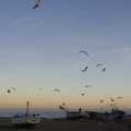 Seagulls take flight over fishing boats on Aldeburgh beach