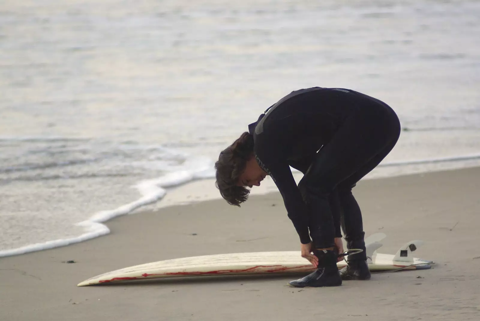 A surfer ties his board to his ankle, from San Diego 8: The Beaches of Torrey Pines, and Ramona, California, USA - 29th February 2008