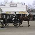 A horse-and-cart clops by on Julian's Main Street