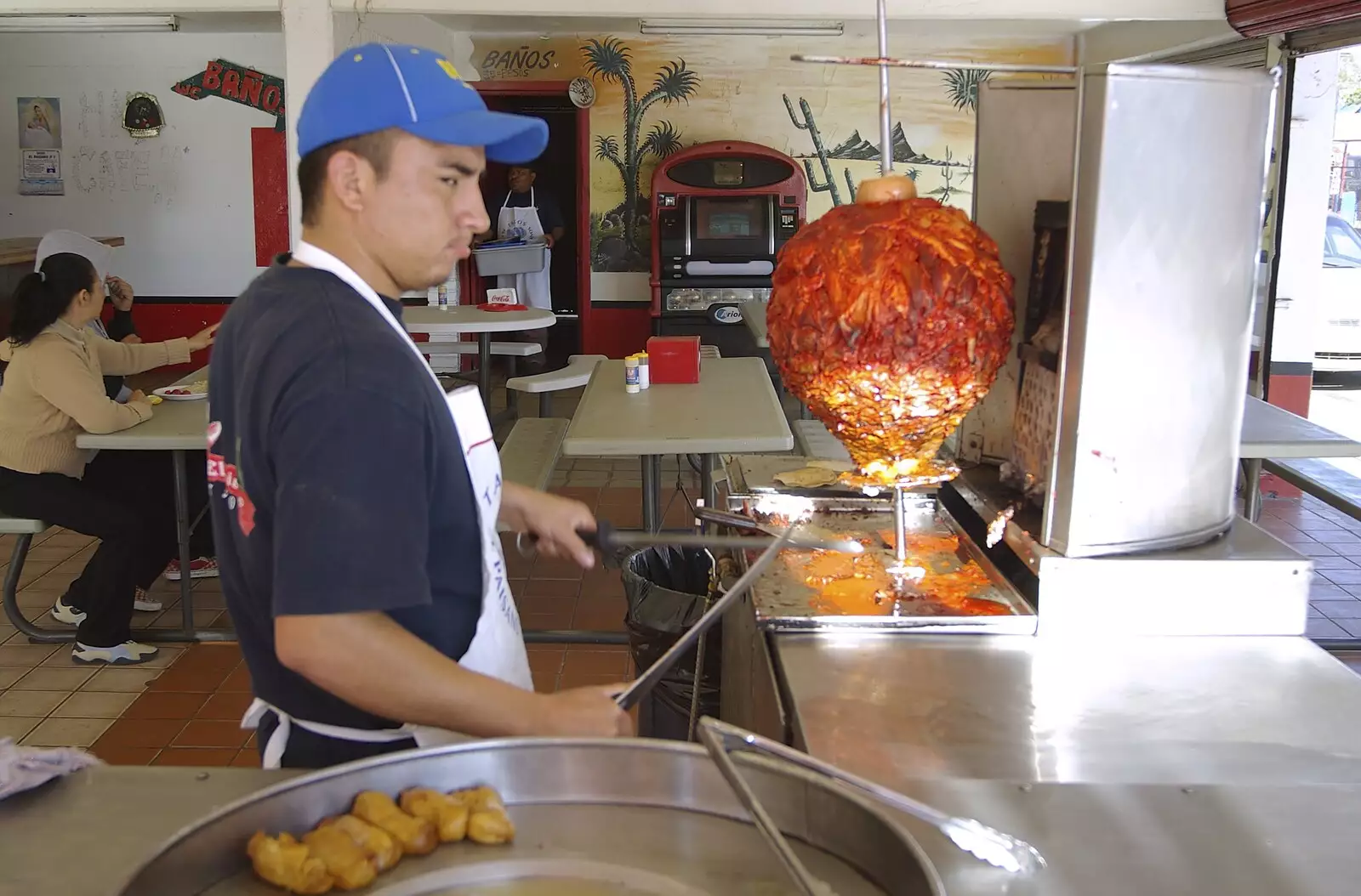 The taco dude prepares to slice the al pastor pork, from Rosarito and Tijuana, Baja California, Mexico - 2nd March 2008
