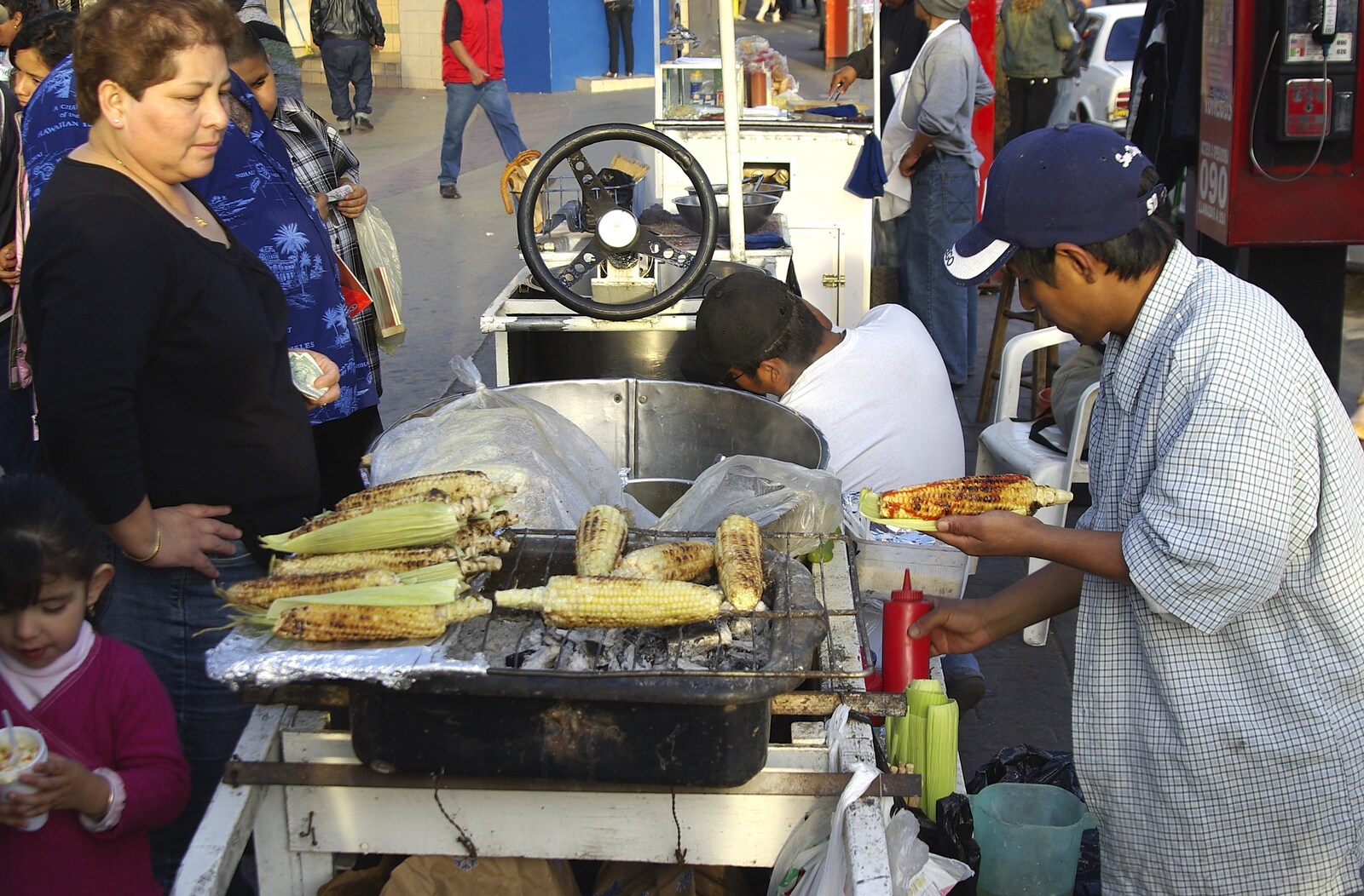 Rosarito and Tijuana, Baja California, Mexico - 2nd March 2008: Grilled corn-on-the-cob from a street vendor