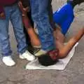 An entertainer lies on broken glass and is stood on, Rosarito and Tijuana, Baja California, Mexico - 2nd March 2008