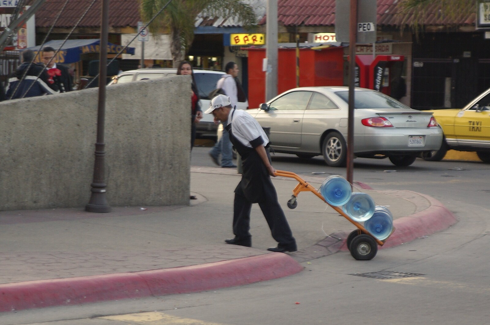 Rosarito and Tijuana, Baja California, Mexico - 2nd March 2008: A dude hauls around bottles of water