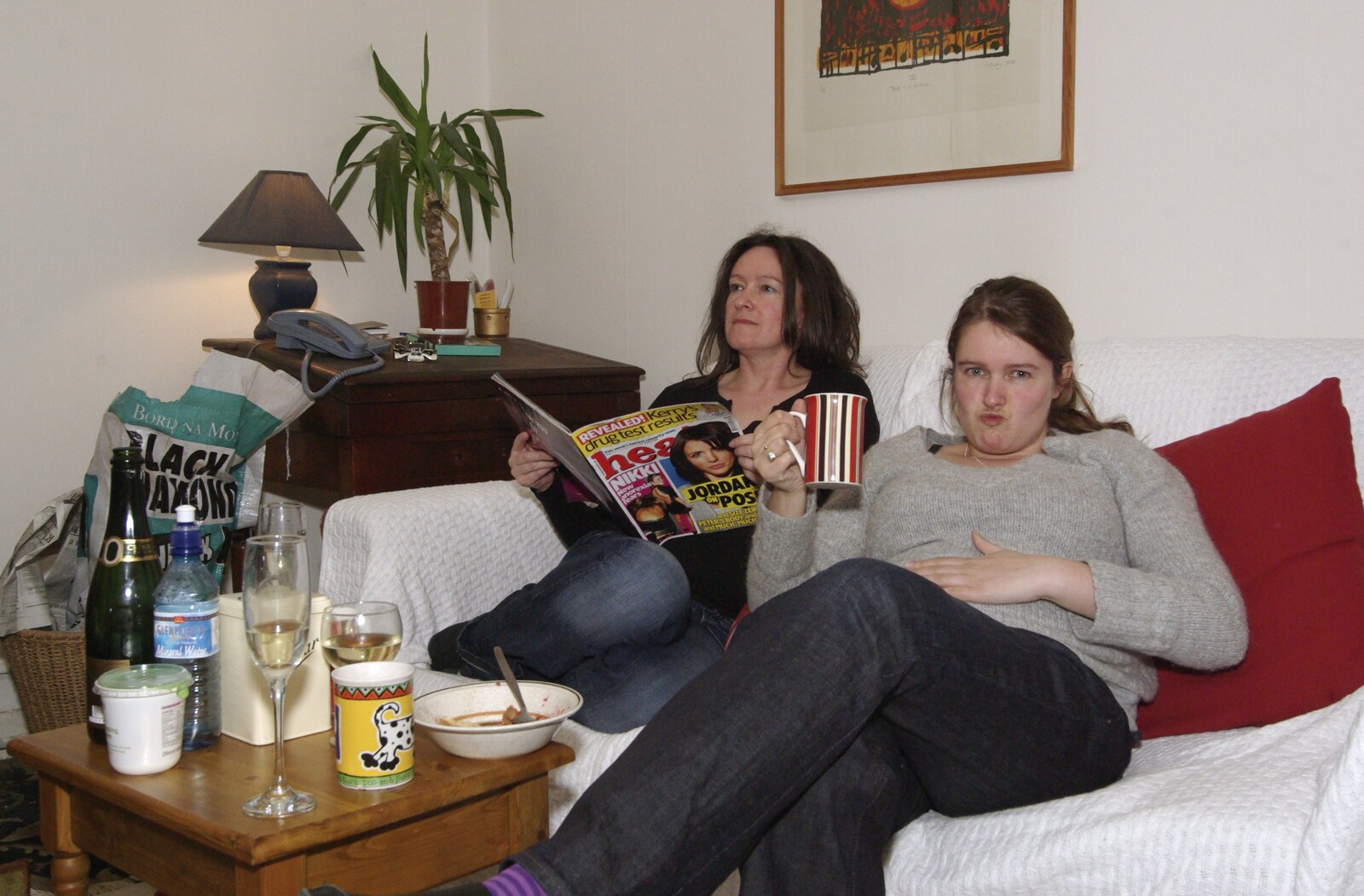 Evelyn reads a trashy magazine as Isobel has tea from Easter in Dublin, Ireland - 21st March 2008