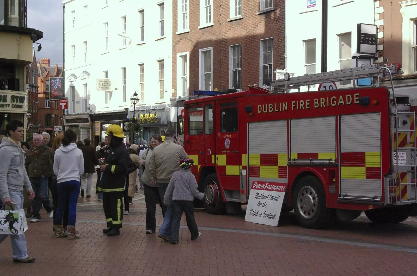 A fire engine does fund-raising on Grafton Street, from Easter in Dublin, Ireland - 21st March 2008