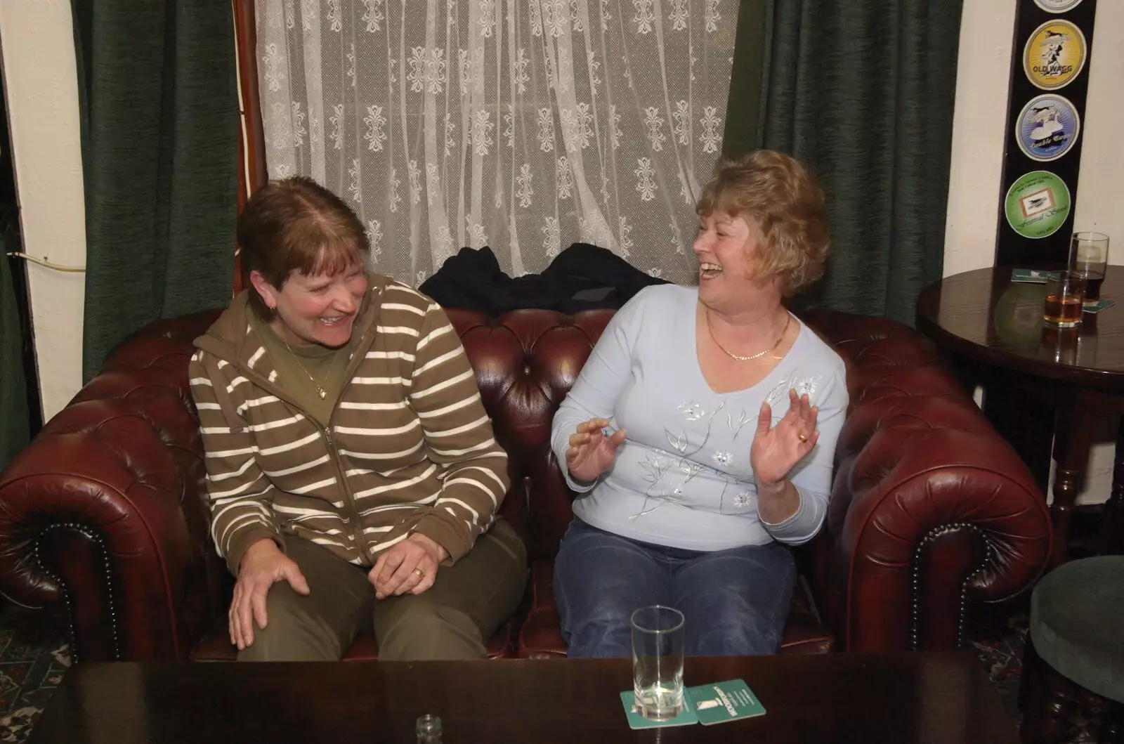 Two women dance to the music on a leather sofa, from The Harvs at the Cherry Tree, and The BBs at Toft Monks, Suffolk and Norfolk - 6th April 2008