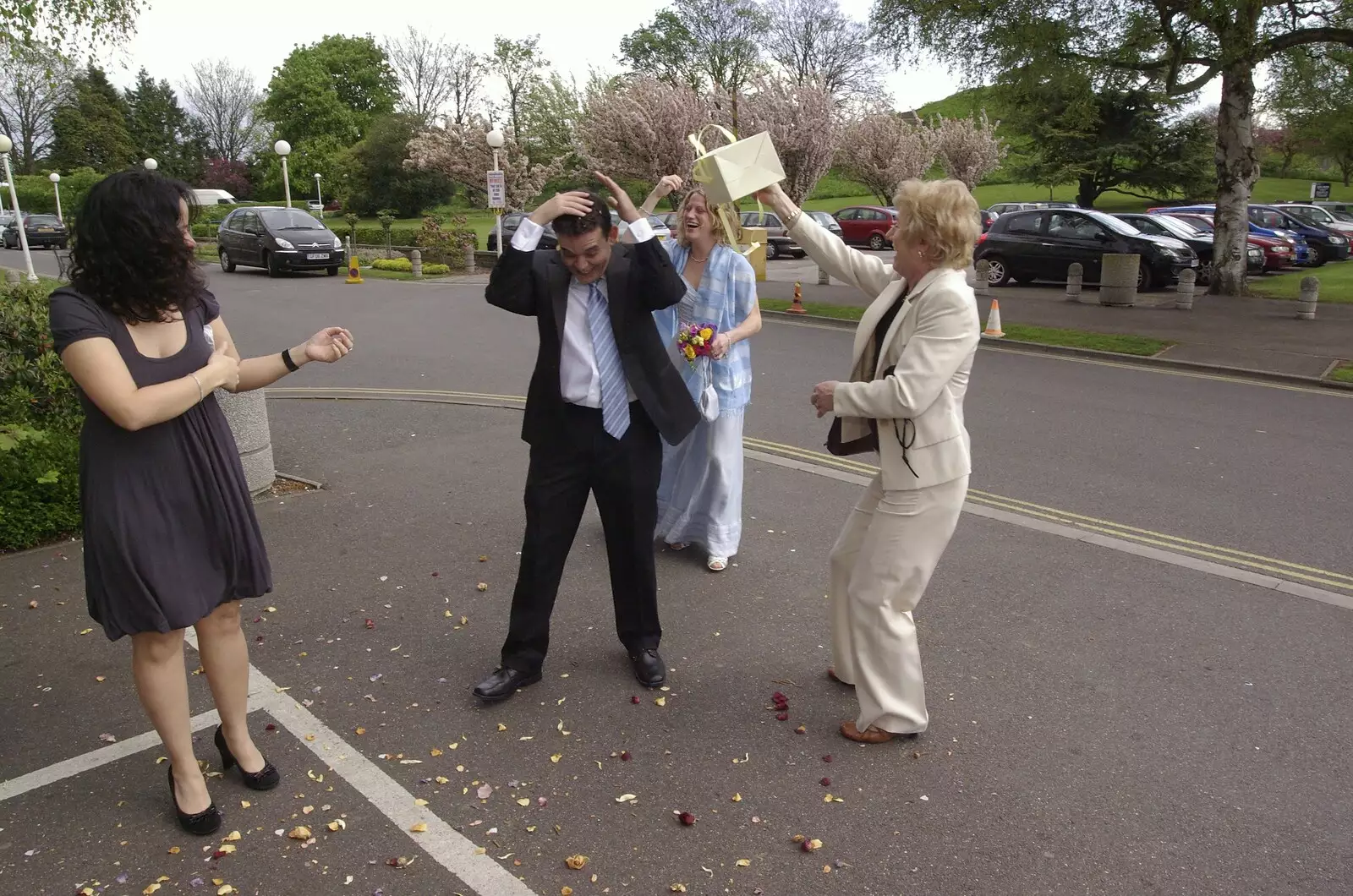 The remains of the confetti is tipped on Hani, from Hani and Anne's Wedding, County Hall, Cambridge - 2nd May 2008