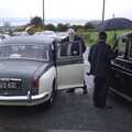 A lovely old Austin Riley and a London Black Cab wait to take the bridge, groom and bridesmaids away to the reception